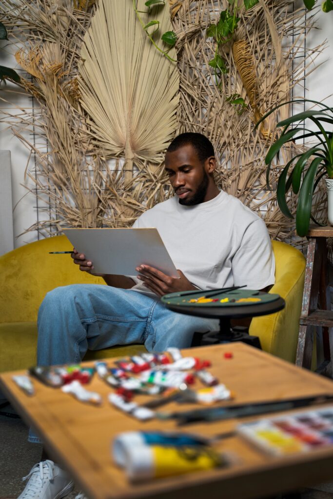 Someone working on a painting that he loves